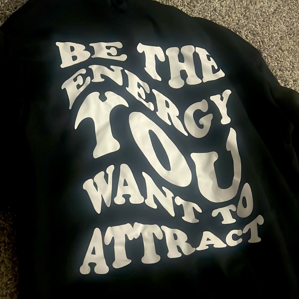 This is an all black hoodie. Lightly worn.